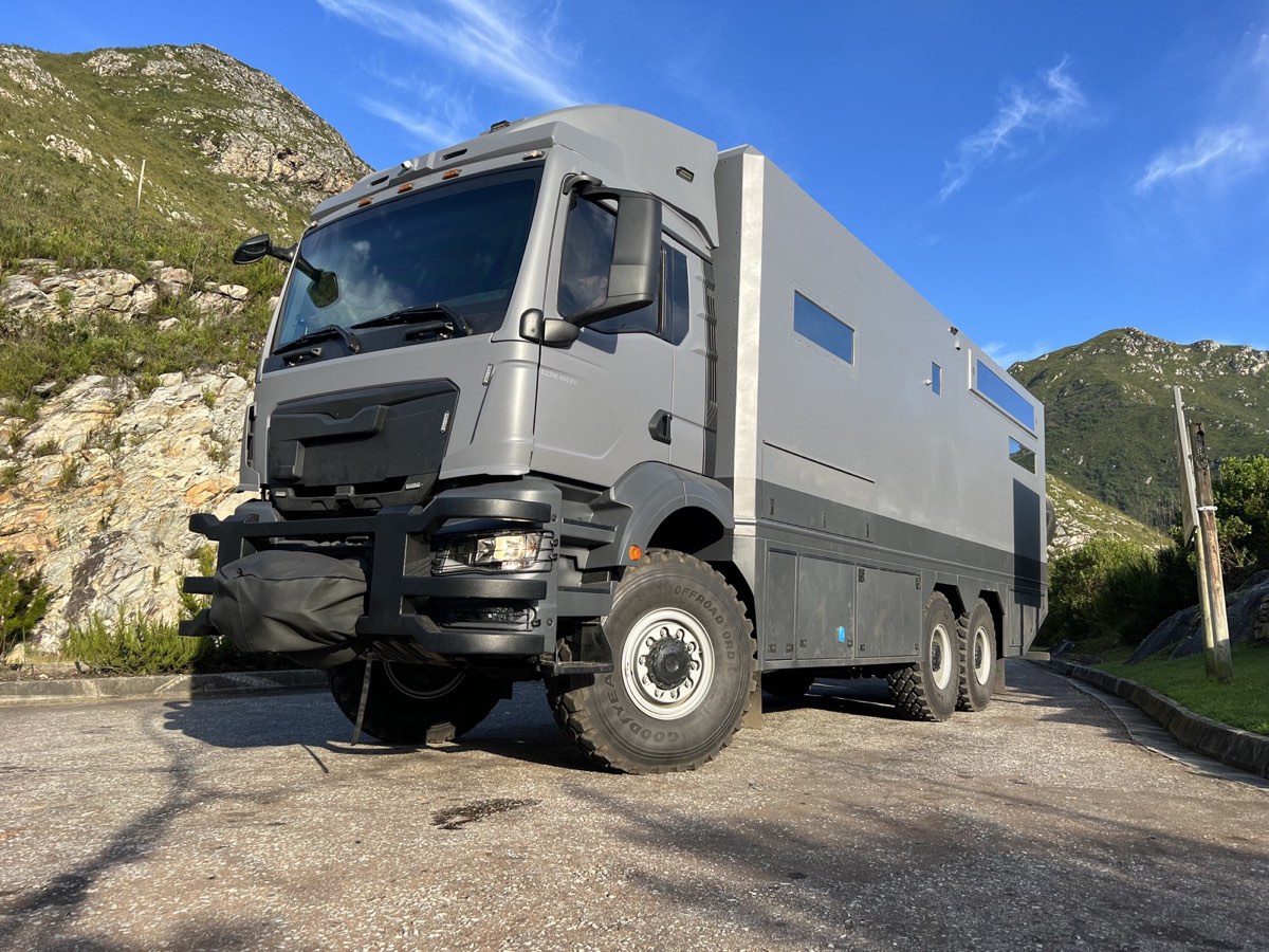 6x6 armoured expedition motorhome at dusk
